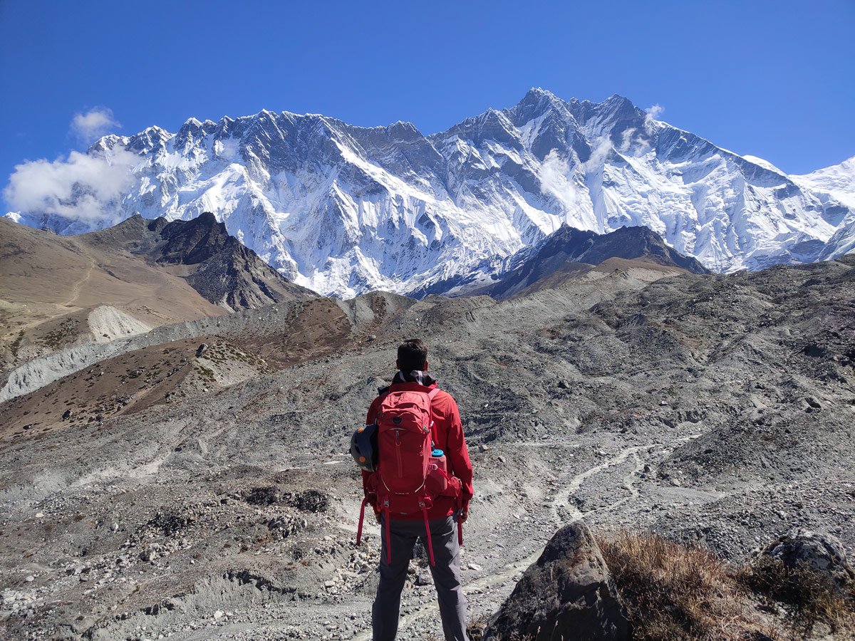 Trekker looking at Mt Lhotse