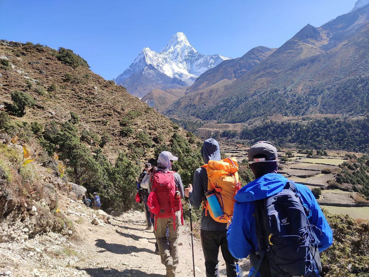 Trekkers arriving at Pangboche with Mt Amadablam in the background
