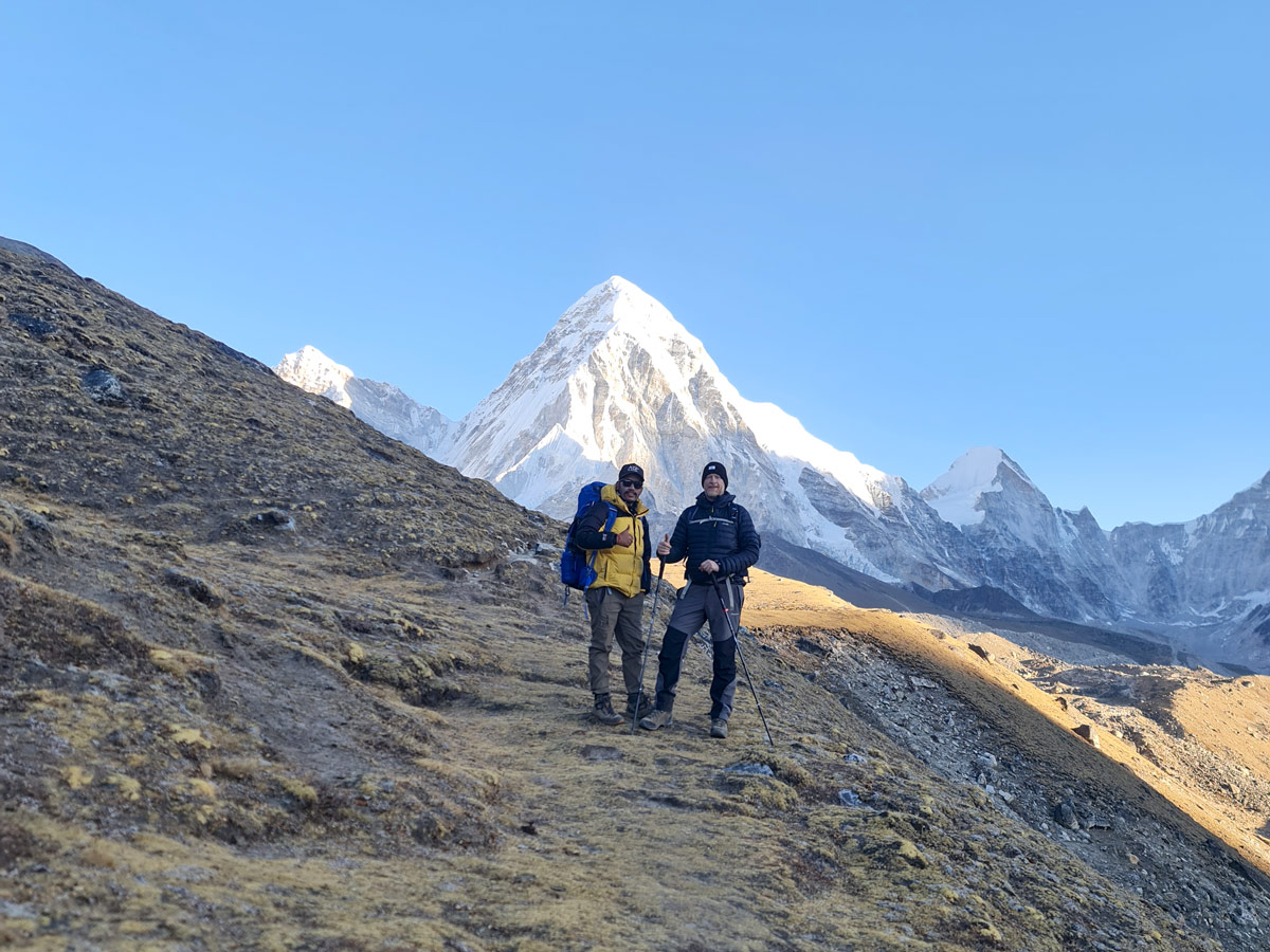 Trekkers enroute to Gorakshep with Mt. Pumori in background